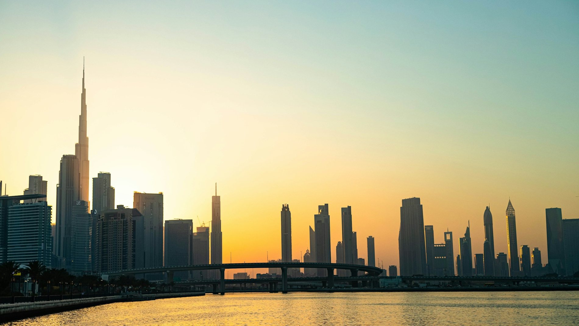 The Downtown Dubai skyline at golden hour, Burj Khalifa on the left